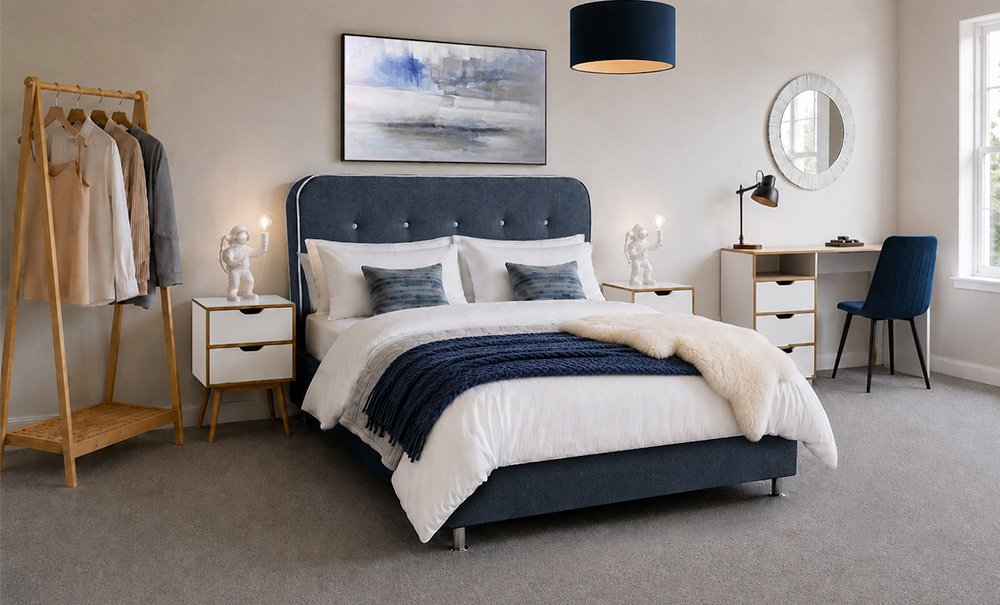 Navy blue bedroom with astronaut lamps and calm coastal artwork