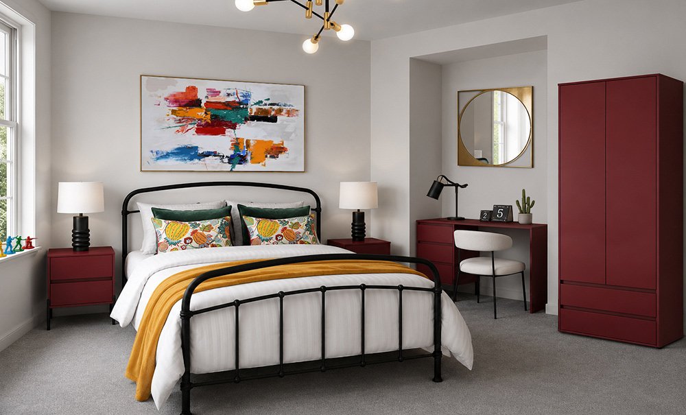 Red bedroom with black iron bed and colourful abstract artwork